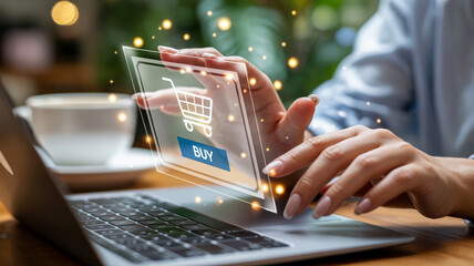 Hands using laptop with online shopping interface and coffee cup in the background on the table