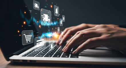 Person typing on a laptop with e commerce icons floating above the keyboard in a dark environment