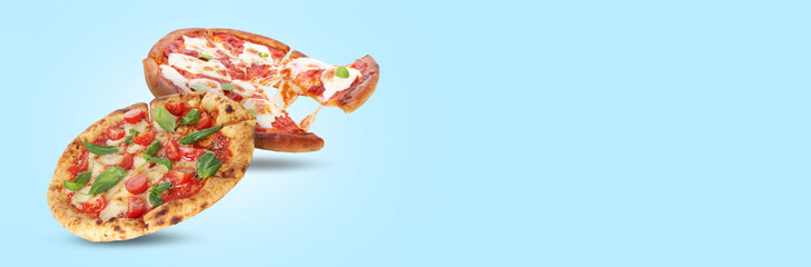 Different delicious pizzas in air on light blue background. Banner design with space for text