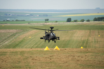 close-up front view of a hovering Boeing Apache Attack helicopter AH2 AH64E AH-64E ArmyAir gunship