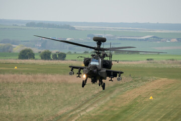 close-up front view of a hovering Boeing Apache Attack helicopter AH2 AH64E AH-64E ArmyAir gunship