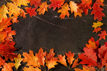 Frame with maple leaves on marble background, autumn abstract composition, Thanksgiving concepts, seasonal background, greeting card or invitation, banner for screen, autumn greeting concept.