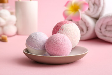 Composition with tray and bath bombs on pink background, closeup