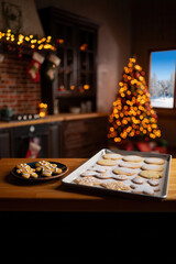 Festive Baking Scene with Decorated Cookies and Warm Christmas Decor