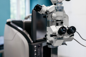 Advanced ophthalmology equipment featuring a high-precision laser vision correction device, showcasing intricate details and modern technology in a clinical examination setting