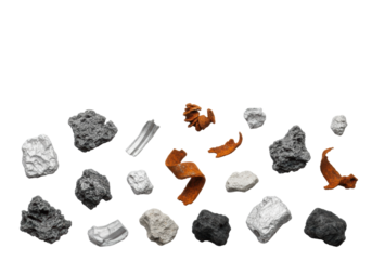 Gritty charcoal gray shredded plastic, rusty orange metal shavings, dull silver & muted black industrial debris scattered on a transparent background with copy space, photorealistic studio shot,