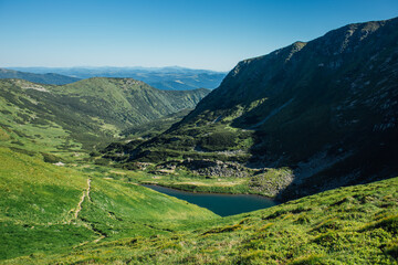 Landscape with mountain lake Brebeneskul. Green carpathian nature