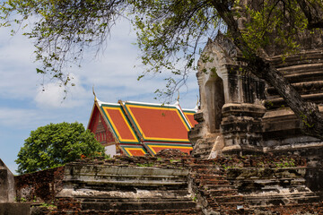 Old Buddhist temple ruins in a green park landscape in Ayutthaya, Thailand
