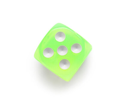 Green game dice on white background