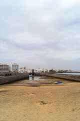 Blue Rowboat and Historic Port Walls, Arrecife © WildFrame