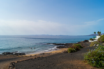 Secluded Volcanic Beach with Cliff View © WildFrame