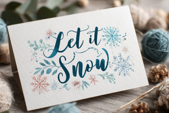 Watercolor Christmas card with the inscription Let it Snow festive holiday illustration with snowflakes and decorative elements isolated on a wooden background