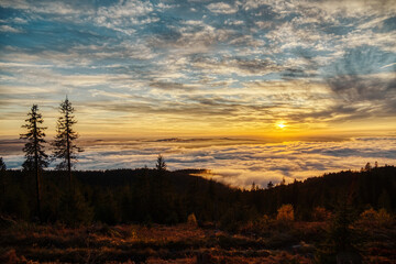 Sunset over mountain landscape with clouds and forest at Dreisessel in Lower Bavaria