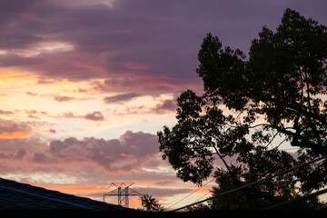 Open sky above rooftops and power lines