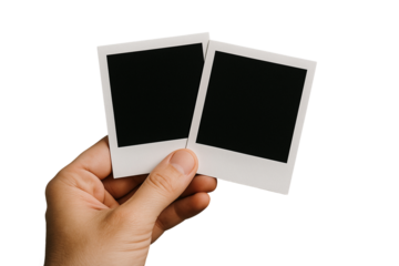 Hand holding two blank instant photo frames, PNG transparent background