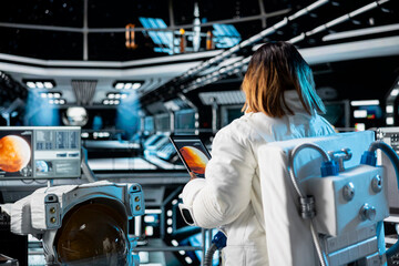 Astronaut studies mission plans before Mars expedition aimed at preparing for future of mankind. Crew prepares to explore planet surface in search of signs that could support human life beyond Earth © DC Studio