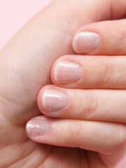 manicure at a beauty salon or at home, nail and hand skin care, nail service salon, manicure and pedicure. woman paints her nails with nail polish.