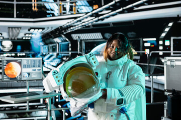 Jolly astronaut analyzing Mars planetary data in spacecraft powered by advanced engineering. Upbeat starship crew member exploring deep space, doing Martian surface research