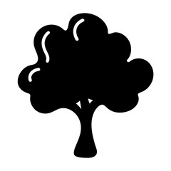 Stylized silhouette of a tree with rounded canopy and thick trunk