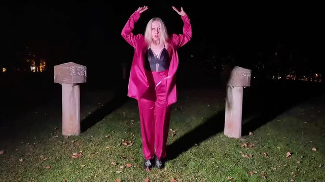 Professional dancer performing waacking at night