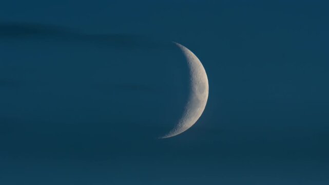 Close up of crescent moon illuminated against a deep blue sky
