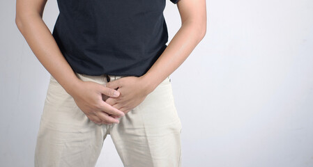 Erectile dysfunction concept. Close up of man holding his crotch. Men's health. Man holding...