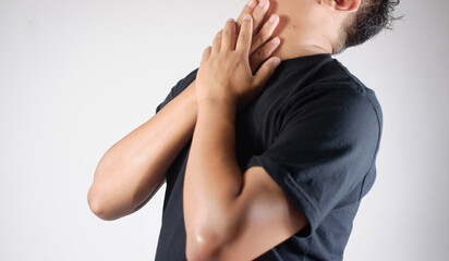 Sore throat, man with neck pain or sore throat, health problem concept. Young man with sore throat...