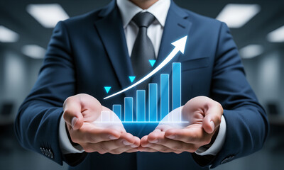 Businessman holding a glowing bar chart with an upward arrow symbolizing business growth and success