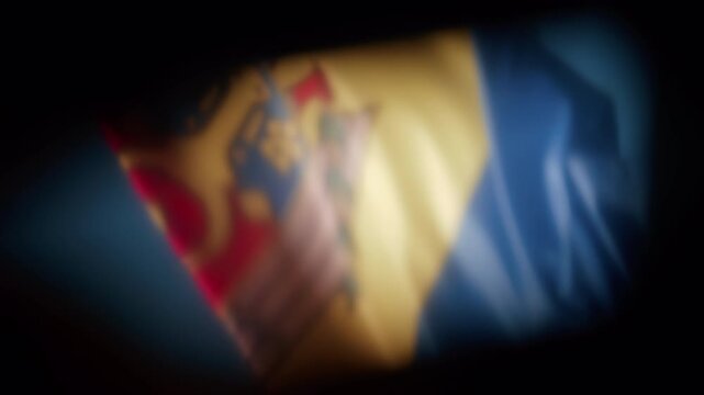 Soft focus close up of the Moldovan flag waving in the wind
