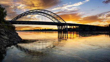 Dramatic sunrise panoramic view of the Veterans Memorial Bridge over the Missouri River at St. Charles, MO