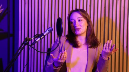 Podcast host recording talk show in studio