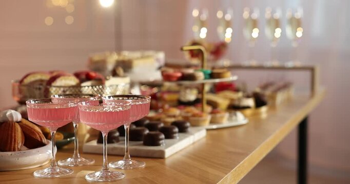 Many different desserts and drinks on buffet table at party, closeup
