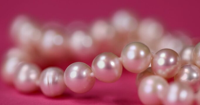 pearls from a marine mollusk used in the manufacture of women's jewelry beads, a necklace made from natural pearl beads strung on a string