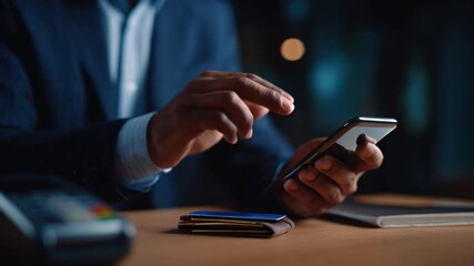 Mobile Commerce & Transaction: Close-up on the hands of a person using a smartphone to make a payment or conduct a transaction, highlighting the ease of modern finance. - Powered by Adobe