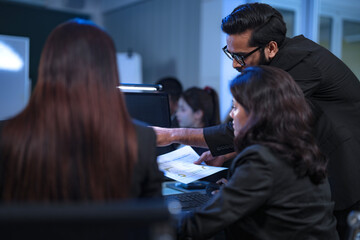 In a 24 7 Security Operations Center, a diverse incident response team works together under pressure, analyzing real-time threat intelligence data to defend against a live cyberattack.