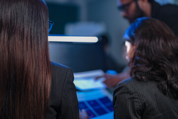 In a 24 7 Security Operations Center, a diverse incident response team works together under pressure, analyzing real-time threat intelligence data to defend against a live cyberattack.