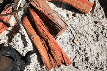 Bonfire wood burning under morning sunlight. Camping Traditional outdoor cooking. Vacation and Holidays activity.
