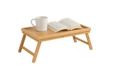 Fototapeta premium Reading a book and drinking coffee on bamboo bed tray