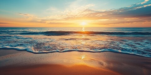 A serene beach scene with a vibrant sunset, calm waves, and a sandy shore.