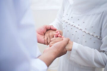 bride and groom holding hands