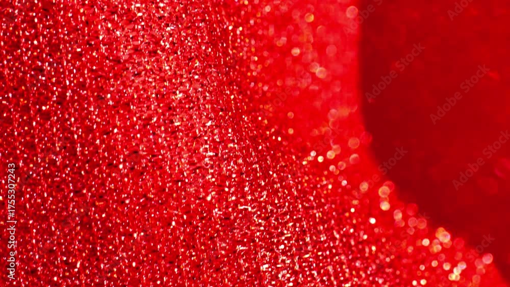 Wall mural red glitter macro background with shining bokeh .iridescent gradient texture.folds of shiny fabric i