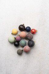 overhead view of vintage Christmas ornaments, top view of antique Christmas tree baubles, pastel Christmas tree decoration