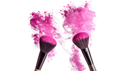 Two makeup brushes with pink powder burst, isolated on transparent background