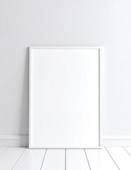 A simple white frame rests on the polished wooden floor of an empty, sunlit room, with soft shadows casting around it, evoking a sense of solitude.