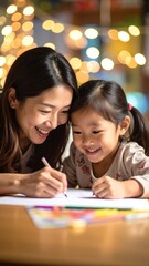 A woman and a young child sit together at a wooden table, focused on writing on sheets of colorful paper, surrounded by crayons and markers.