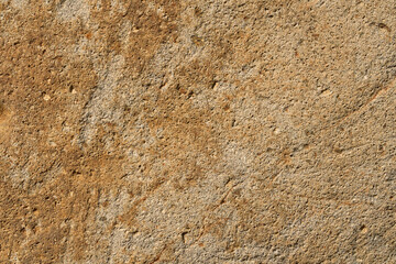 表面に凸凹のある茶色い石のクローズアップ。石や岩のテクスチャー