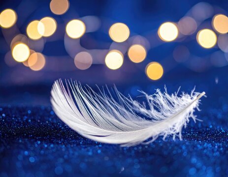 White feather on sparkling blue with blurred golden lights - Powered by Adobe