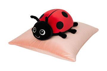 Cute ladybug plush resting on soft pillow for comforting nursery decor