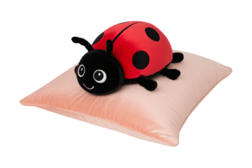 Cute ladybug plush resting on soft pillow for comforting nursery decor