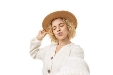 Young woman enjoying winter vibes with playful pose, isolated, PNG